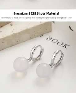 Detailed macro shot of 925 silver earring featuring a milky translucent agate bead