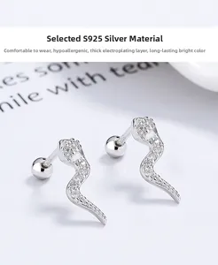 Close-up of S925 sterling silver snake screw earrings with sparkling white cubic zirconia