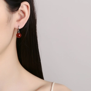 Elegant 925 sterling silver drop earrings featuring polished round red agate beads