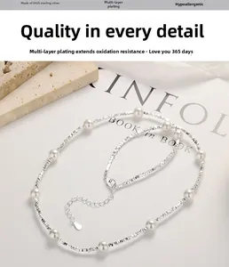 Detail of 925 sterling silver necklace with white pearls and adjustable lobster clasp