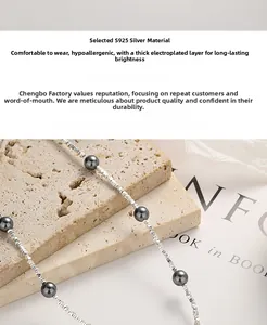 Macro detail of S925 silver beaded necklace with grey pearls and thickened plating