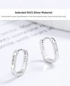 Detailed close-up of S925 sterling silver hoop earrings with screw motifs and cubic zirconia