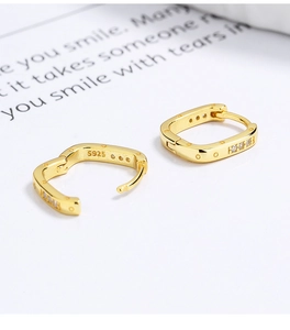 Detailed view of square gold earrings in 925 sterling silver with micro-pave crystals