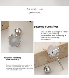 Pendiente de plata S925 con cuenta gris, detalle de corazón hueco y cierre de rosca
