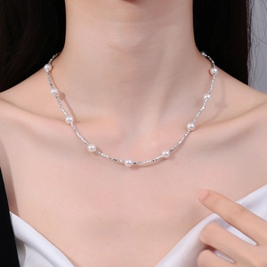925 silver pearl necklace with textured silver beads worn on model neck for women