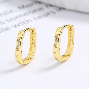 925 silver hoop earrings with gold plating and cubic zirconia in a minimalist style