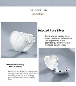 Detailed macro view of S925 sterling silver heart earrings showing hinge and hallmark