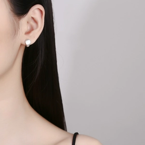 Modern 925 sterling silver frosted water drop earrings shown in an elegant side profile view
