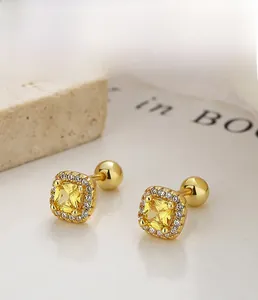 Detail of 925 silver square yellow zircon stud earrings with screw back butterfly clasp