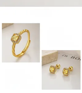 Detail of S925 silver jewelry set with yellow square gemstones and pave-set crystals
