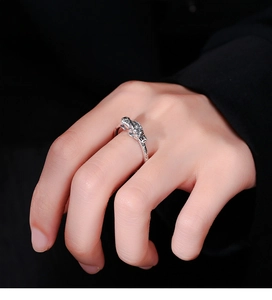 Macro detail of vintage 925 sterling silver Pixiu ring with embossed relief and oxidized finish