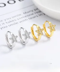 Detail of 925 sterling silver flower hoop earrings with zircon pavé in gold and silver