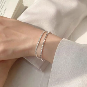 Double-layered 925 sterling silver chain bracelet set with sparkling grain beads