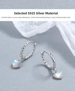 Detailed close-up of S925 sterling silver hoop earrings with iridescent moonstone heart pendants