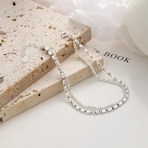 Elegant 925 sterling silver double-layer bracelet with polished beads and sparkling chain