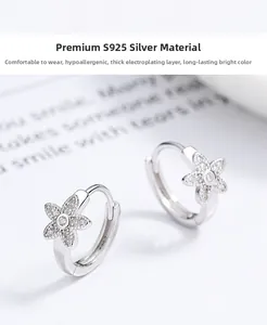 Macro detail of S925 sterling silver flower hoop earrings with pavé diamond setting
