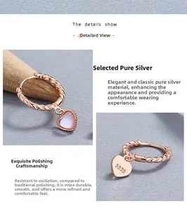 Detailed macro view of S925 sterling silver heart earrings with rose gold finish and opal