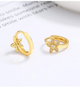 Detailed close-up of 925 sterling silver gold star hoop earrings with zircon and S925 hallmark