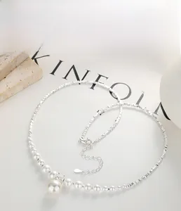 Detail of S925 sterling silver necklace with large pearl pendant and silver bead chain