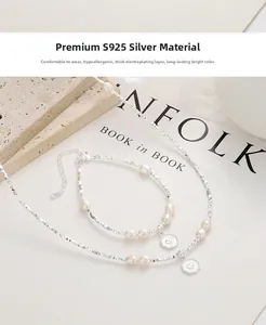 Detail of S925 silver necklace and bracelet set with pink pearls and heart pendants