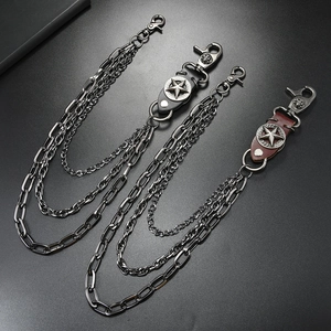 Three-layer punk star jeans chain with dark metal links and leather skull details