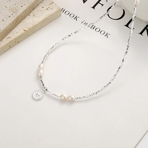 925 silver beaded necklace with white pearls and a delicate heart engraved pendant