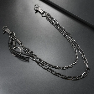 Detail of punk multi-layer metal pants chain with black leather tassel and lobster clasps