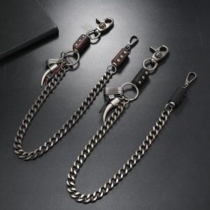 Three vintage punk style metal jeans chains with skull charms and leather straps
