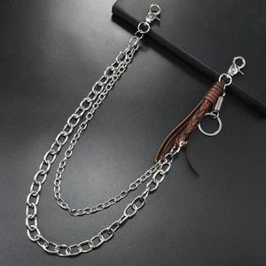 Detail of punk double-layer metal wallet chain with brown braided leather fringe