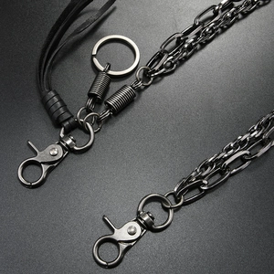 Detail of gunmetal multi-layer jeans chain with leather tassels and lobster clasps
