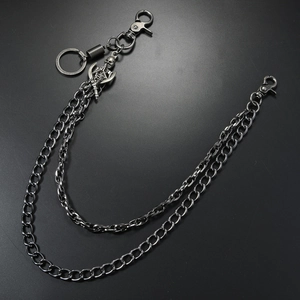 Detail of hip hop punk wallet chain featuring skull pendant and dual metal layers