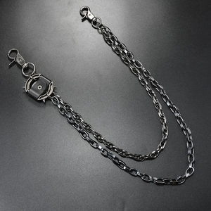 Detail of gunmetal multi-layer punk wallet chain with spiked elements and lobster clasps