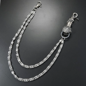 Detail view of double-layered punk style silver metal chains with lobster clasps