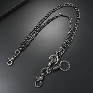 Double-layered punk skull hip-hop wallet chain with dual lobster clasps on black surface