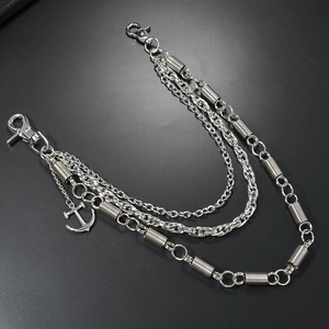 Close-up of triple-layered silver metal pants chain with spring links and small anchor charm