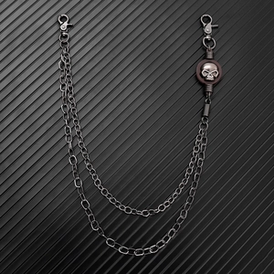 Detail of gunmetal double-layer hip hop pants chain with metallic skull charm and lobster clasps