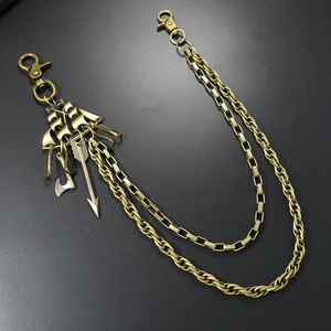 Detail of vintage bronze punk waist chain with nautical charms and dual-layer metal links