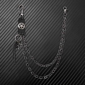 Detail view of double-layered punk pants chain with star leather patch and silver hooks