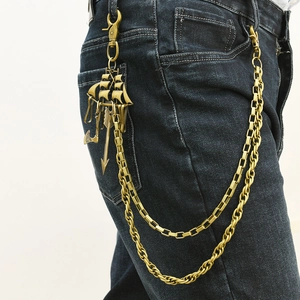 Vintage multi-layer pant chain with sailboat and anchor charms on blue jeans