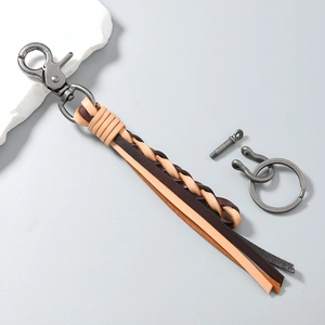 Handcrafted woven leather keychain with horseshoe D-ring and gunmetal hardware