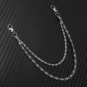 Detail of silver double-layered punk wallet chain with cross-motif ball links