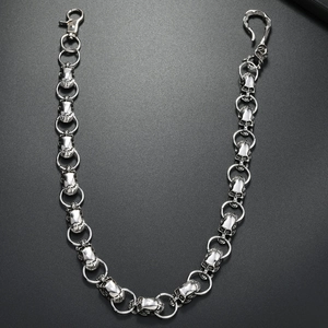 Detailed close-up of punk style silver alloy skull chain with lobster clasp and hook