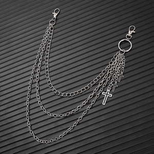 Detail of silver multi-layer punk cross waist chain with lobster clasps and pendants