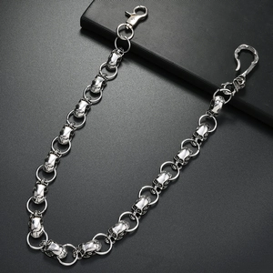 Punk style silver skull trouser chain with dual lobster clasps on a black background