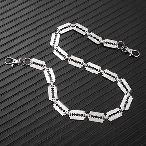Close-up of silver metal punk razor blade trouser chain with double lobster clasps