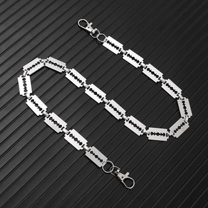 Detail of silver punk trousers chain with razor blade shaped links and lobster clasps