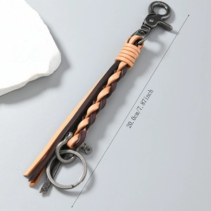 Handwoven leather keychain with vintage lobster clasp and tassel detail, 20cm length