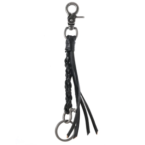 Handcrafted black braided leather keychain with vintage silver horseshoe buckle and tassel