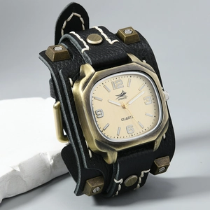 Macro shot of punk style leather cuff watch with retro rivets and white stitching