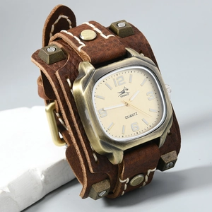 Macro shot of vintage leather watch band with rivets and yellow stitching details